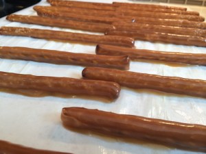 So we dipped the pretzels and let them sit and harden on a buttered piece of parchment paper. This took hours.
