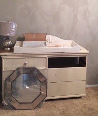 The first task on Sunday was putting together the changing table topper. You can't really see it, but here's the best picture I have.