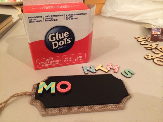 And then took glue dots and fastened the letters to these cute little chalkboard tags I found (at Michael's).