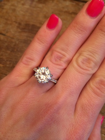 I officially took my rings off (just to be safe) and replaced them with this GAUDY (fake) rock. I'm already regretting buying such a huge ring. It kind of... attracts attention. It's created quite a few blushing/sweaty moments explaining that it's fake and my fingers are just a little fat for my real ring.