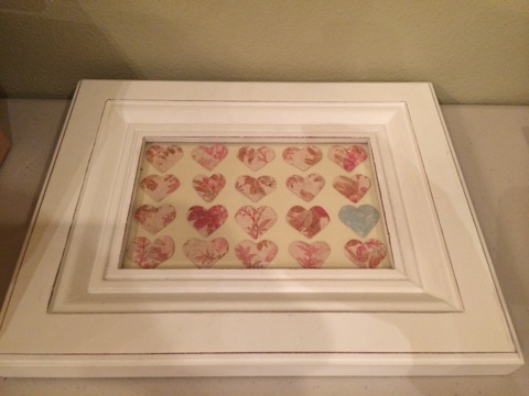 I've started filling the frames for the nursery gallery wall with DIY creations. Thought this turned out well. Just hearts cut out of scrap book paper.