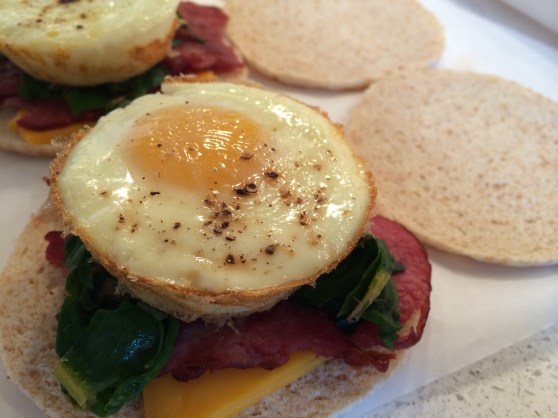 To bake the eggs, set the oven to 350 degrees, crack eggs in greased muffin tin, sprinkle with salt and pepper, and bake for 20 or so minutes (or until set).