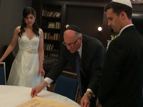 Signing the Ketubah (Jewish marriage license).