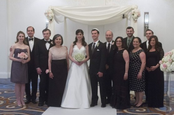 The bride and groom with both families.